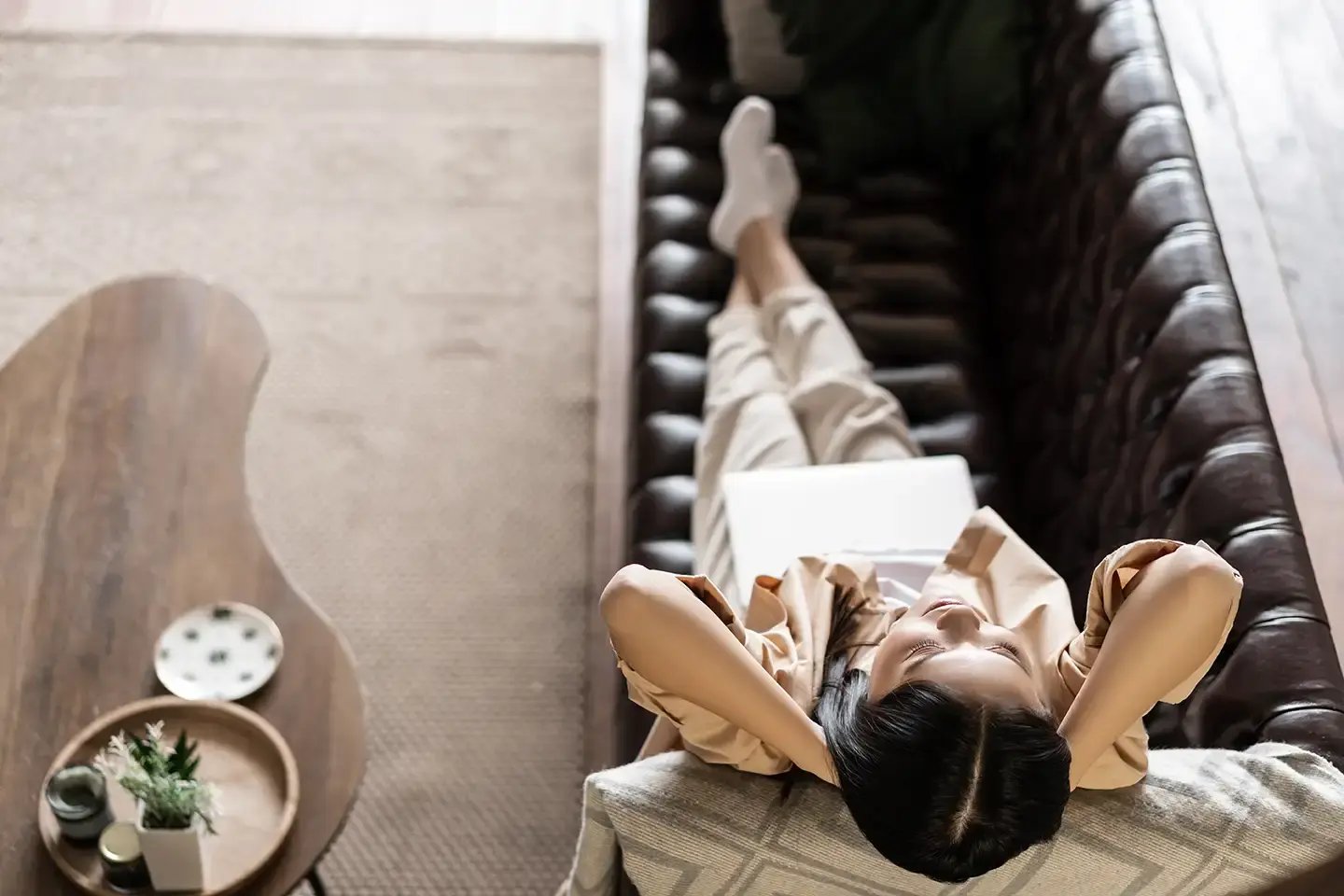 woman-relaxing-on-couch-with-laptop-indoors-2026-03-19-10-42-19-utc