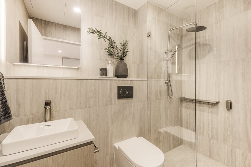 Studio bathroom vanity and shower at Arte Living Caringbah