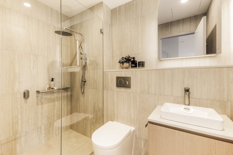 Arte Living Caringbah studio bathroom with walk-in rain shower and stone-look tiles